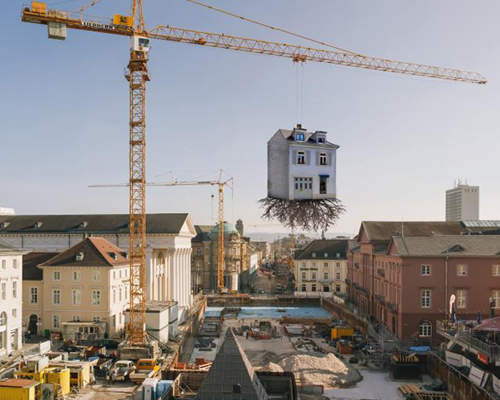 leandro erlich's house is pulled by the roots in karlsruhe