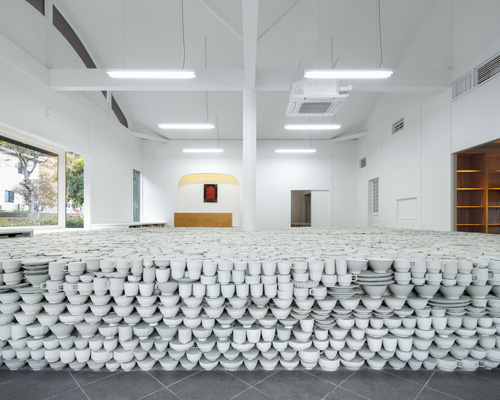 yusuke seki layers unwanted ceramic tableware to form elevated platform in japan