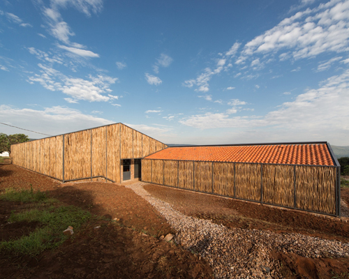 sharon davis design uses handmade bricks and eucalyptus to form housing in rwanda