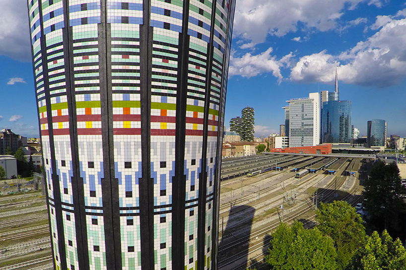 milan's rainbow tower is clad with over 100,000 ceramic tiles