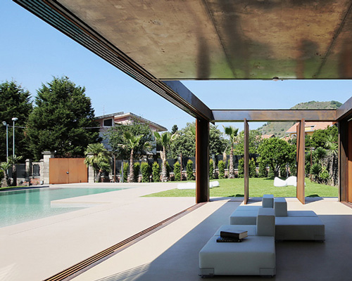 amore campione architettura extends sicilian farmhouse with corten veranda