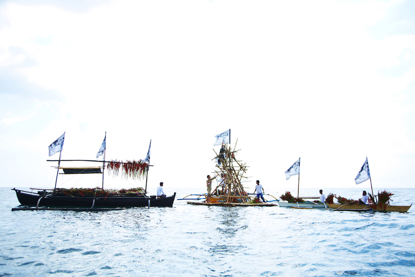 azuma makoto floats a four-meter floral sculpture into the ocean