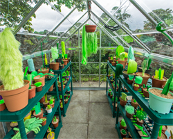 PUTPUT plants a greenhouse filled with faux flora and fauna