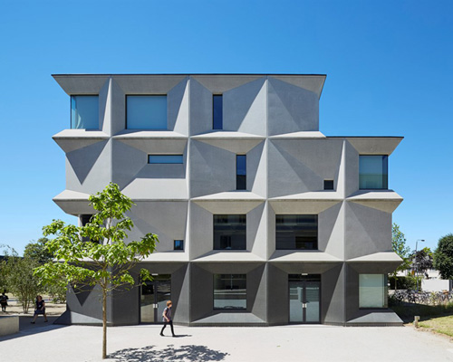 allford hall monaghan morris clads burntwood school with faceted concrete panels
