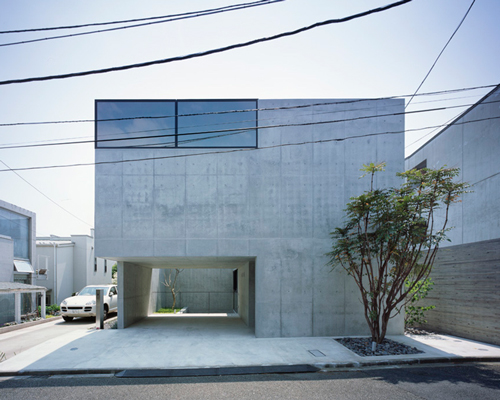 apollo architects forms garage with an overhang in minimalistic grigio house in tokyo