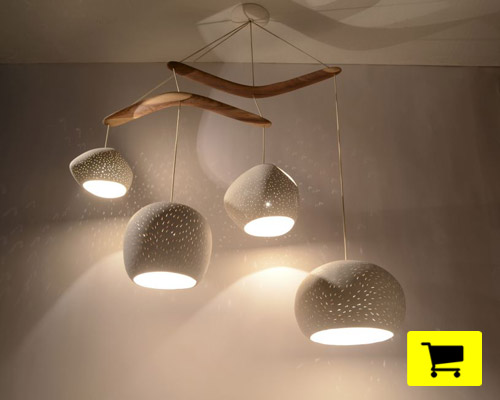 real boomerangs and perforated clay shades render singular fixture