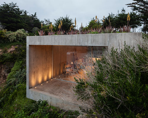 felipe assadi submerges concrete painter's studio in los vilos, chile