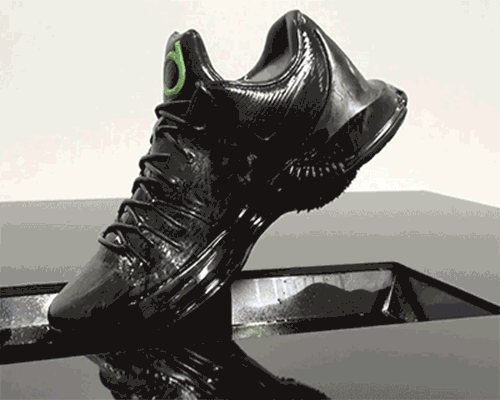 engaging display by guild dips NIKE KD8 sneakers in magnetic ferrofluid