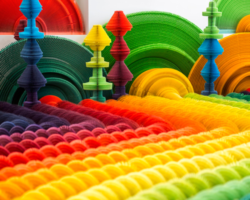 li hongbo examines the conflict of war + weapons with colorful paper gun accordions