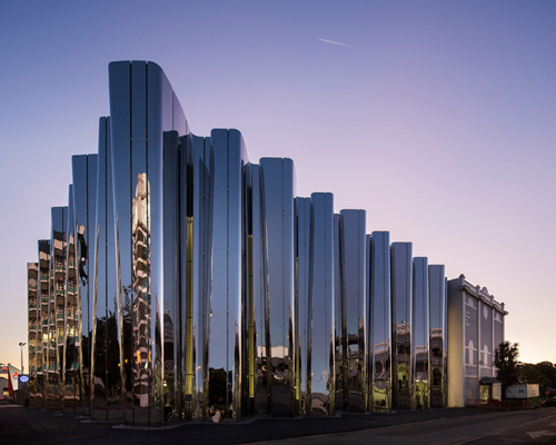 pattersons architects sculpts new zealand len lye art museum with iridescent steel façade