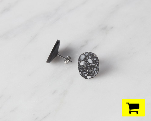 pebble earring reveals embedded marble in a polished finish