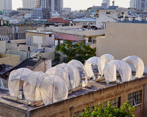 tensile rooftop installation references israel's bedouin tents