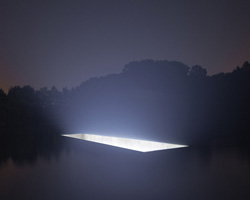 88888 sculpts luminous void within the water surrounding the castle of horst