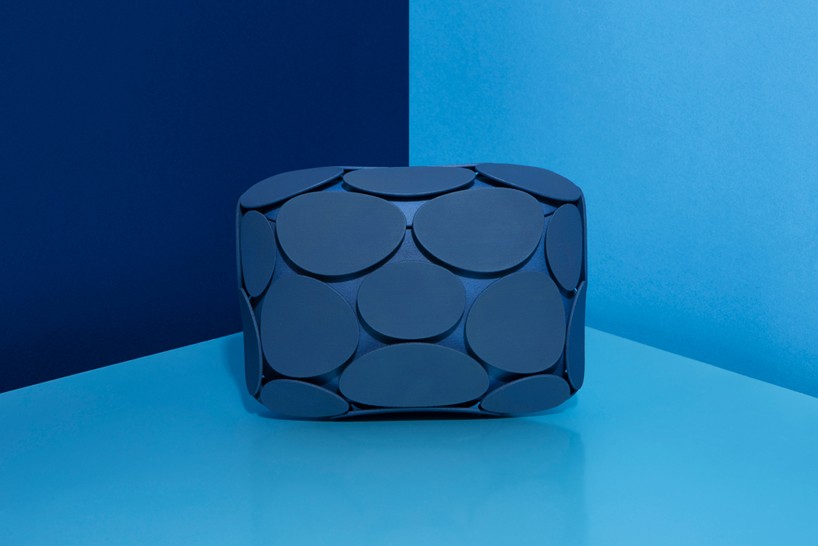 odo fioravanti's armure clutches emulate the plates of pinecones
