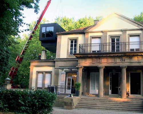 anna philipp adds black werk1 mobile office-box to a historical villa