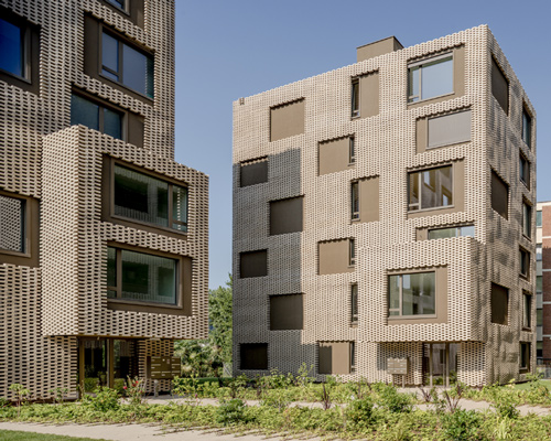 buzzi architetti clads le stelle residences with patchwork brick pattern