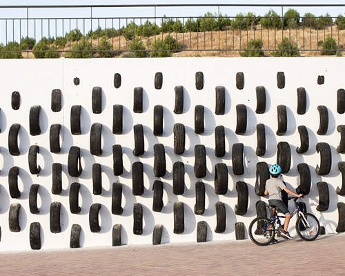 cumul collective reuses old tires in street art installation