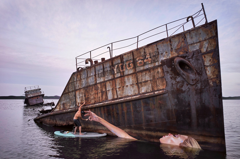 hula paints a floating female on a sunken ship in hawaii while surfing