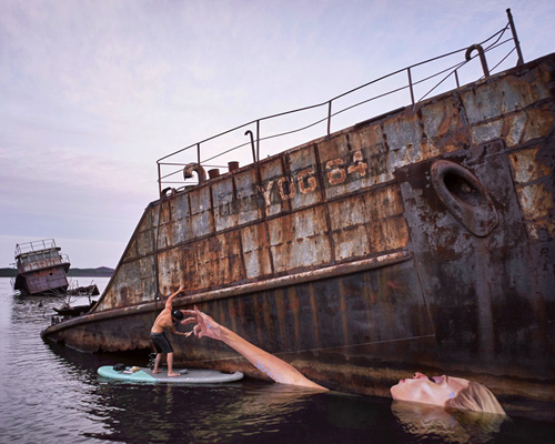 hula paints a floating female on a sunken ship in hawaii while surfing