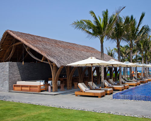 vo trong nghia's naman beach bar combines bamboo, thatch and stone