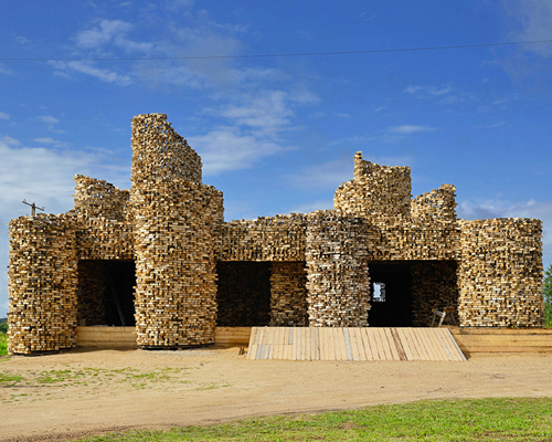 nikolay polissky wraps abandoned soviet shop in an undulating wooden jacket