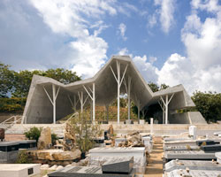 ron shenkin places concrete folded canopy over cemetery pavilion in israel