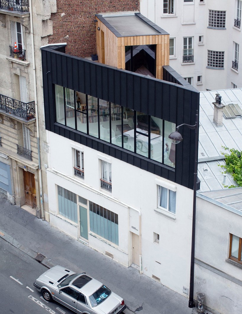 saganaki house employs independent construction atop existing building in paris