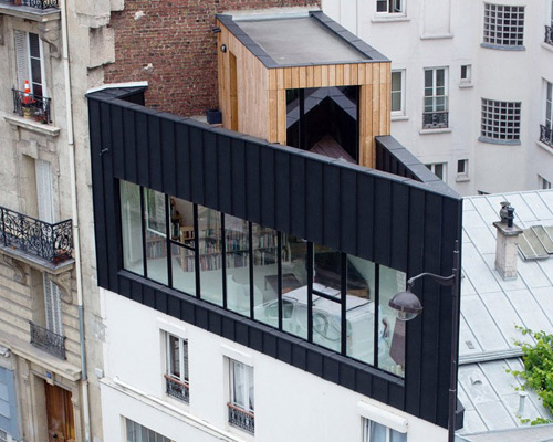 saganaki house employs independent construction atop existing building in paris