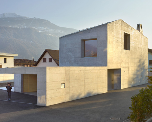 savioz fabrizzi architectes sets gabled concrete dwelling beneath alpine peaks
