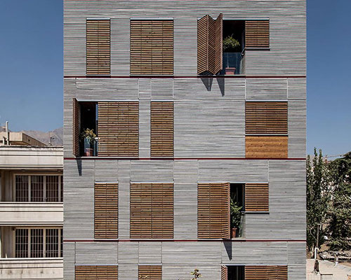 ayeneh office clads andarzgoo residences in tehran with wooden slats