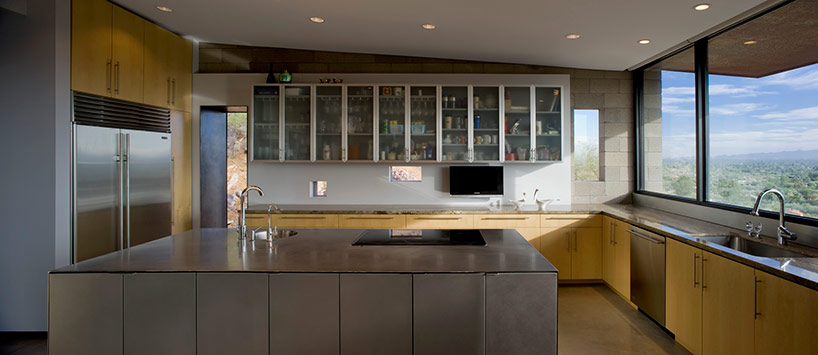 chen + suchart studio embed mummy mountain residence into a slope in arizona