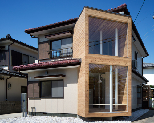 container design protrudes timber volume from traditional japanese home