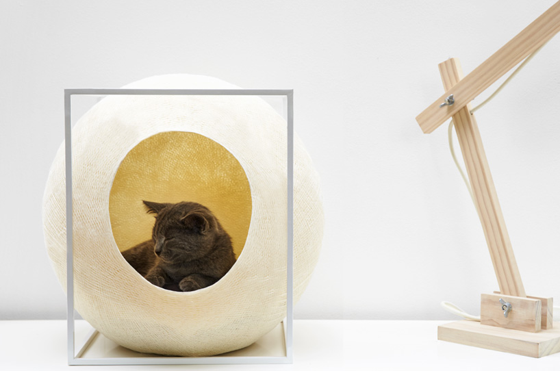 wooden, cushioned mini houses and beds for cats help them relax and sleep  well