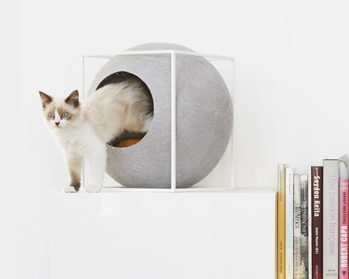 wooden, cushioned mini houses and beds for cats help them relax