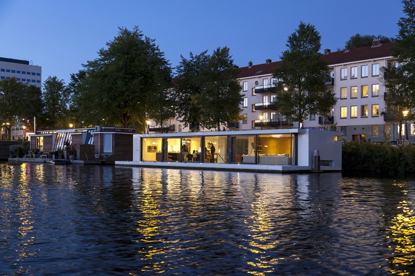 live on the river with +31 architects' floating villa in amsterdam