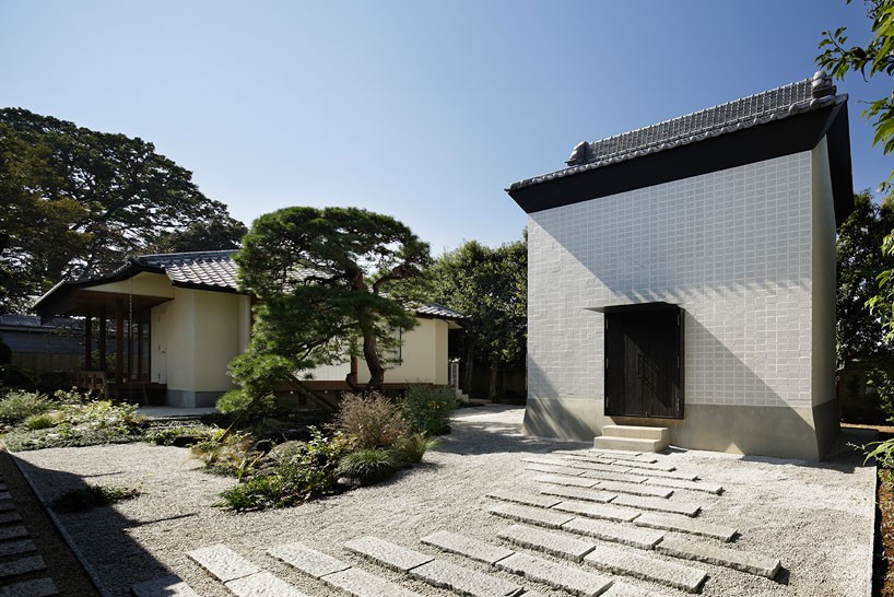ryo matsui conceals guesthouse windows with perforated brick walls