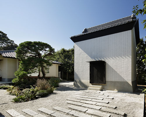 ryo matsui conceals guesthouse windows with perforated brick walls
