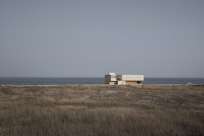 vector architects casts seashore library at water's edge, china