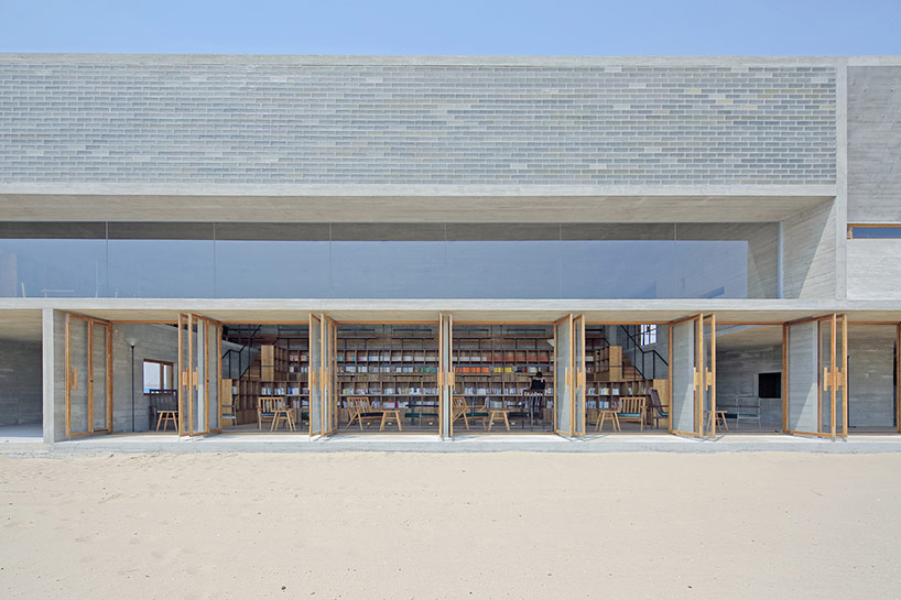 vector architects casts seashore library at water's edge, china