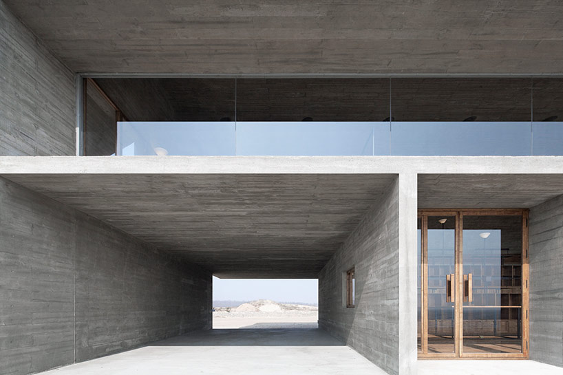 vector architects casts seashore library at water's edge, china