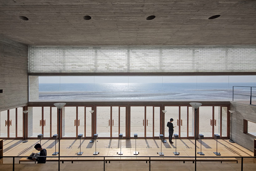 vector architects casts seashore library at water's edge, china