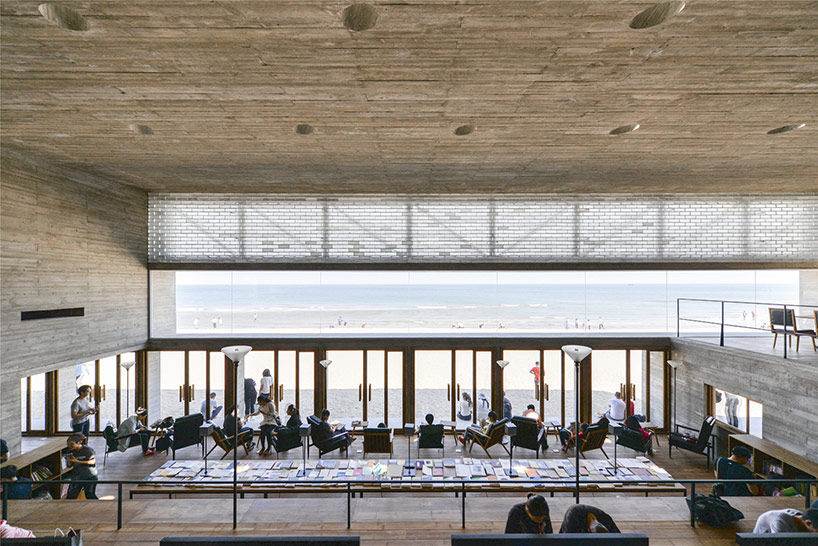 vector architects casts seashore library at water's edge, china