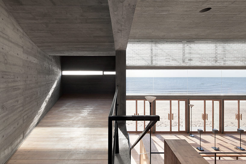 vector architects casts seashore library at water's edge, china