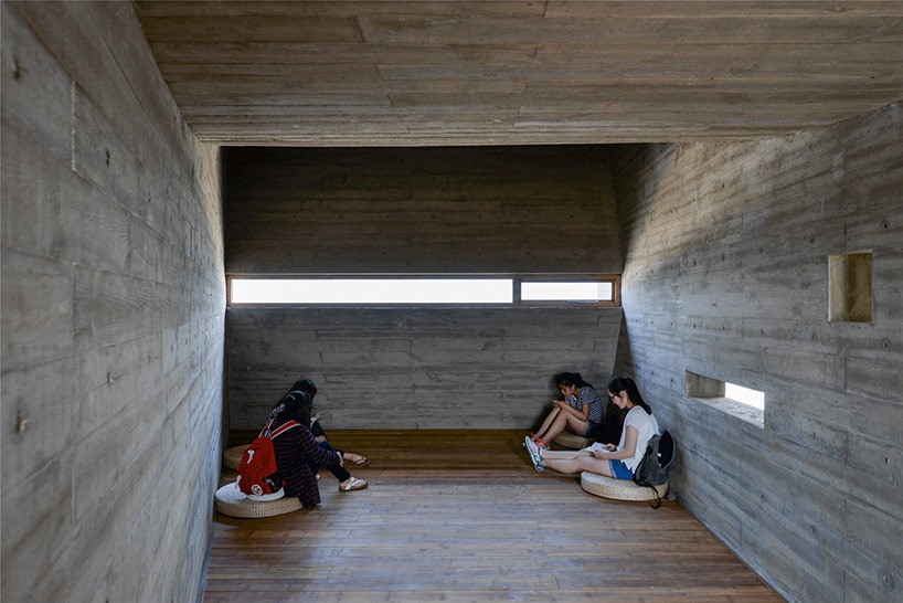 vector architects casts seashore library at water's edge, china