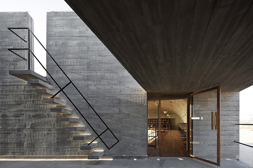 vector architects casts seashore library at water's edge, china