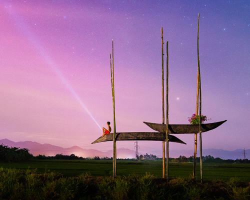 a21studio's boat and bamboo hut acts as shelter for vietnamese farmers