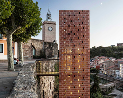 carles enrich wraps 20 meter-high elevator in catalonia with a brick lattice