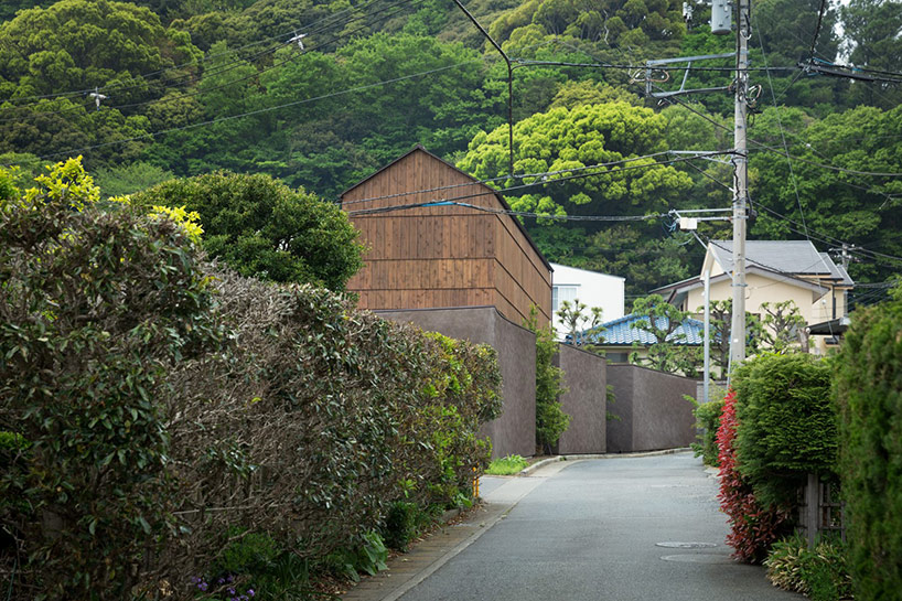 dgt creates house in oiso with timber volume on earthen foundation