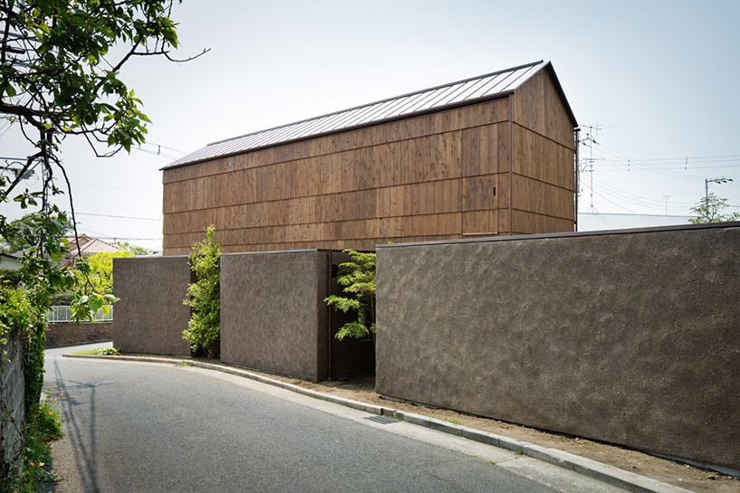 dgt creates house in oiso with timber volume on earthen foundation