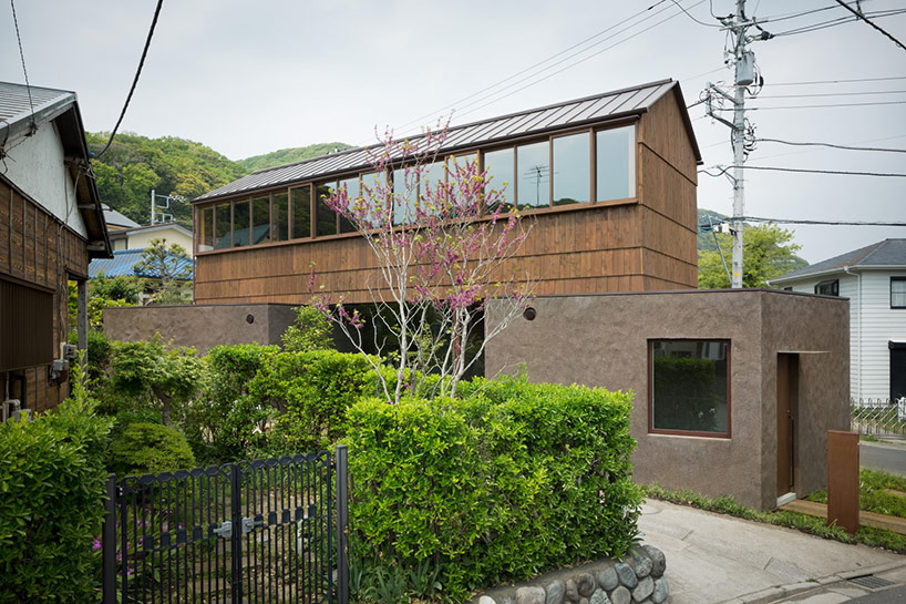 dgt creates house in oiso with timber volume on earthen foundation